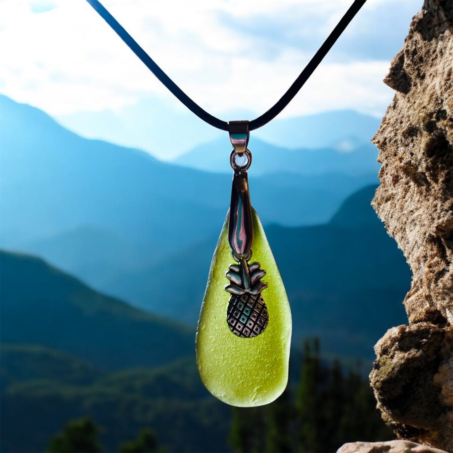 Beautiful Green Seaham sea glass pendant necklace with pineapple charm presented on an 18 inch black nylon chain with a silver lobster clasp