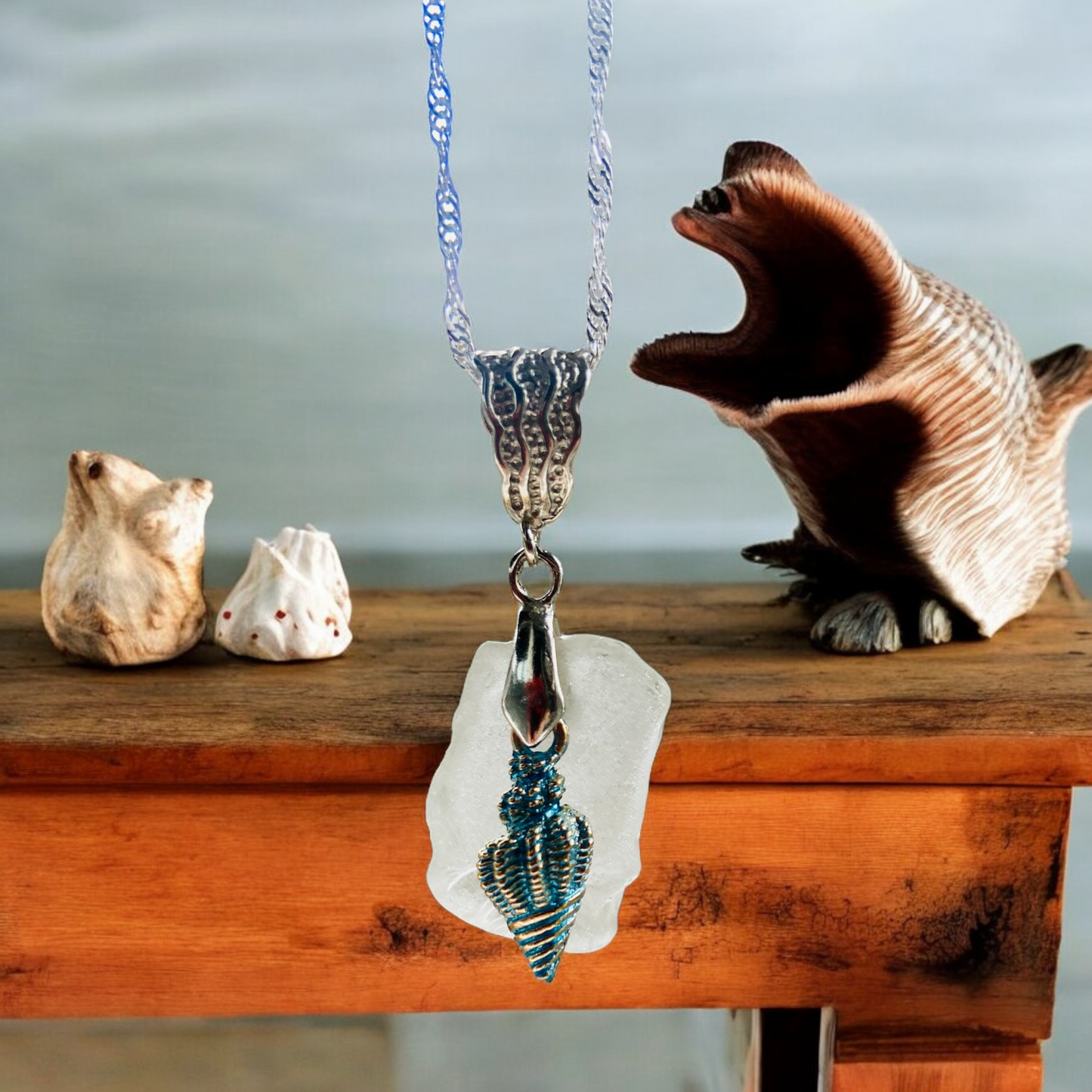 Beautiful handmade White sea glass pendant necklace with shell charm, presented on a 20 inch 925 sterling silver chain