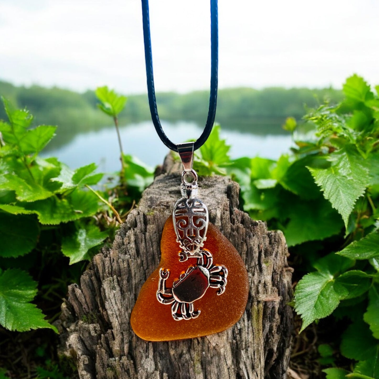 Beautiful handmade Brown sea glass pendant necklace with crab charm presented on a 20 inch black nylon chain with a lobster clasp