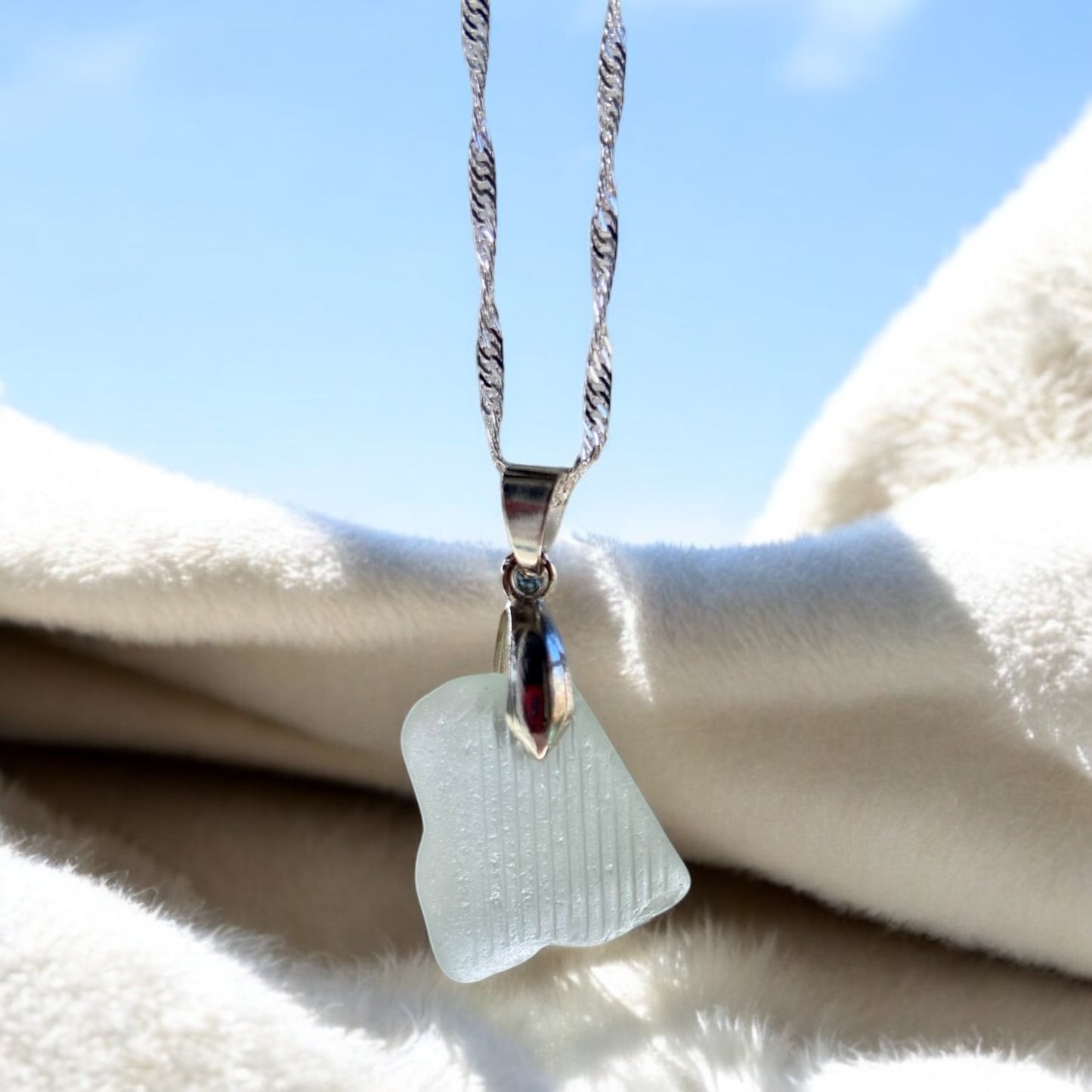 Beautiful handmade white sea glass pendant necklace, presented on a 20 inch 925 sterling silver chain