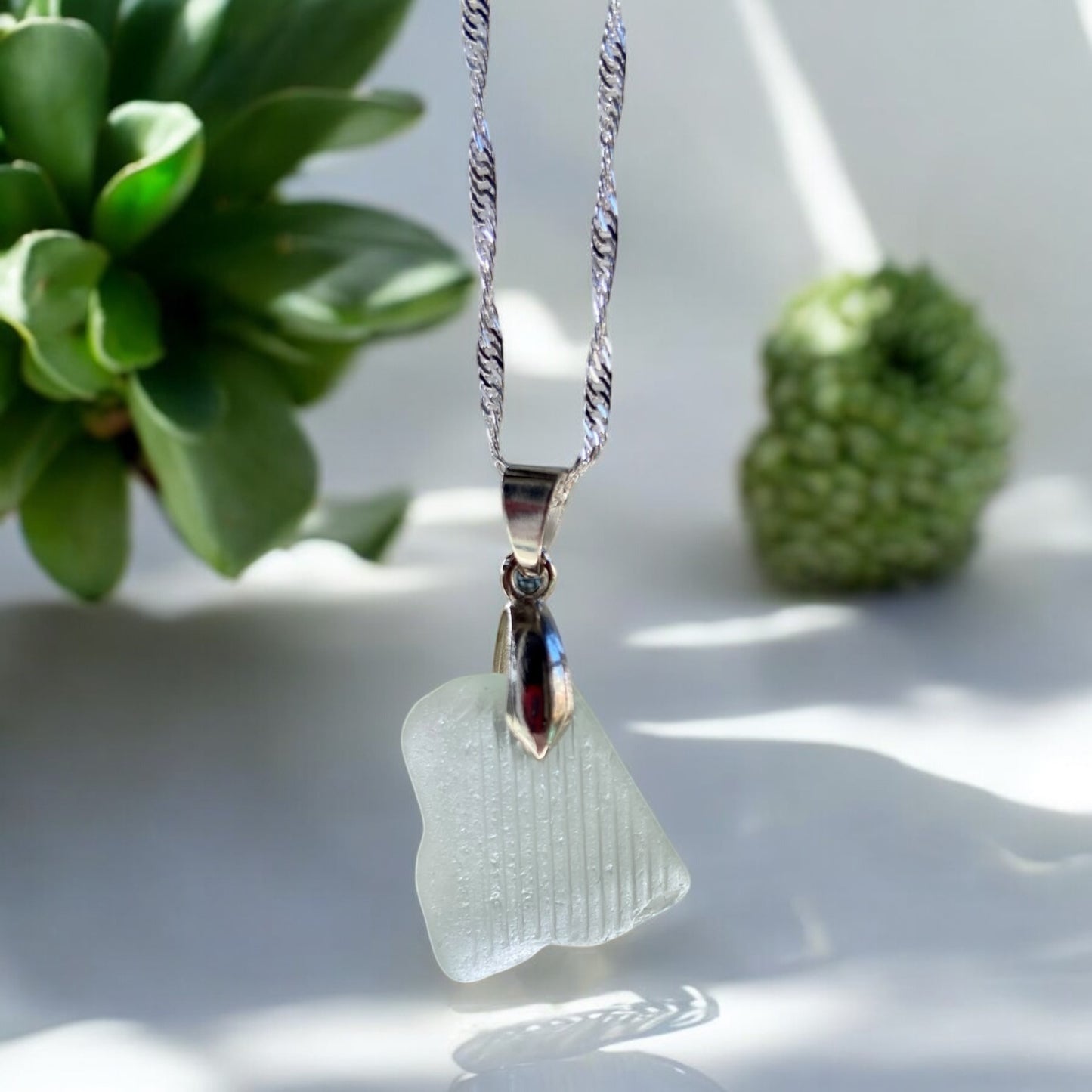Beautiful handmade white sea glass pendant necklace, presented on a 20 inch 925 sterling silver chain