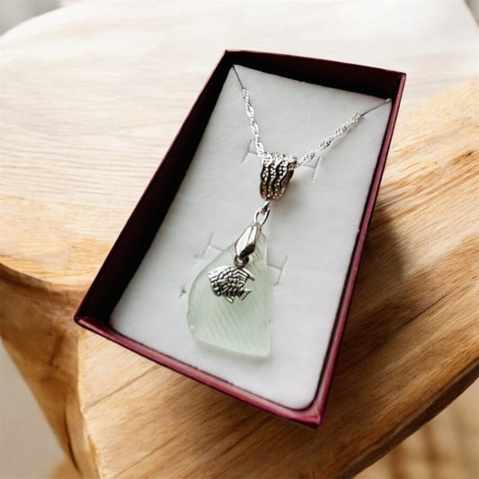 Beautiful handmade White sea glass pendant necklace with fish charm, presented on a 20 inch 925 sterling silver chain