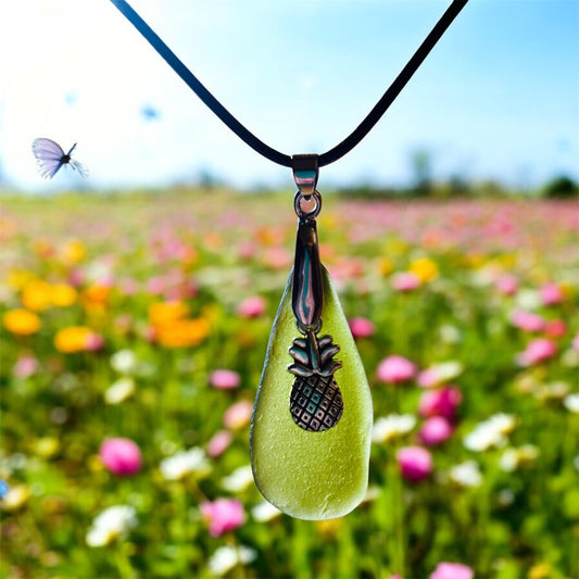 Beautiful Green Seaham sea glass pendant necklace with pineapple charm presented on an 18 inch black nylon  chain with a silver lobster clasp